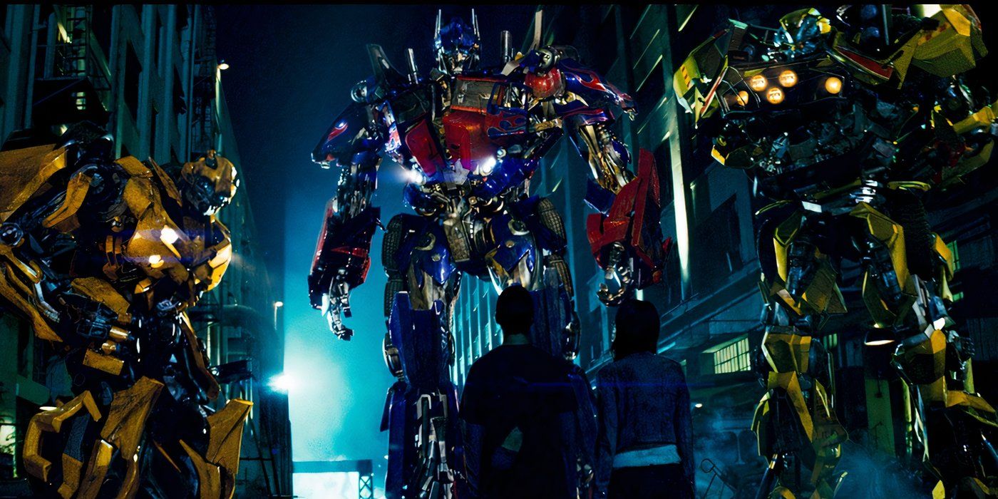 Sam and Mikaela looking up at Optimus Prime in Transformers