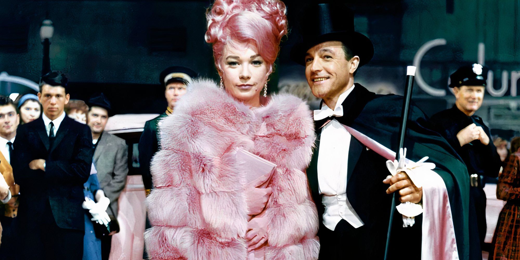 Shirley MacLaine standing with Gene Kelly next to her in What a Way to Go! (1964)