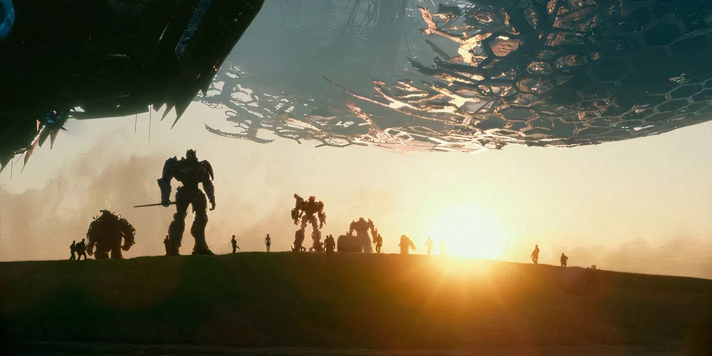 Autobots and humans standing on a hill, silhouetted in Transformers: The Last Knight