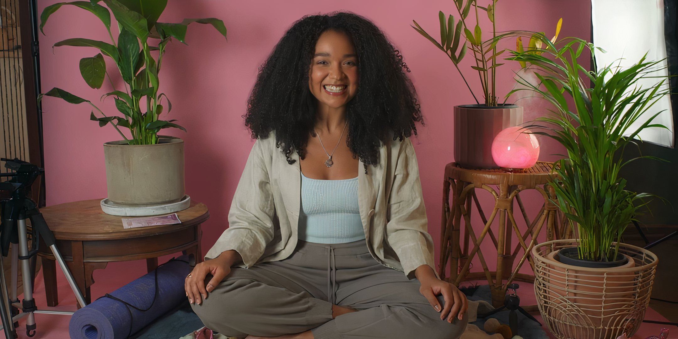 Aisha Dee as Cecilia in front of pink influencer backdrop in Sissy.
