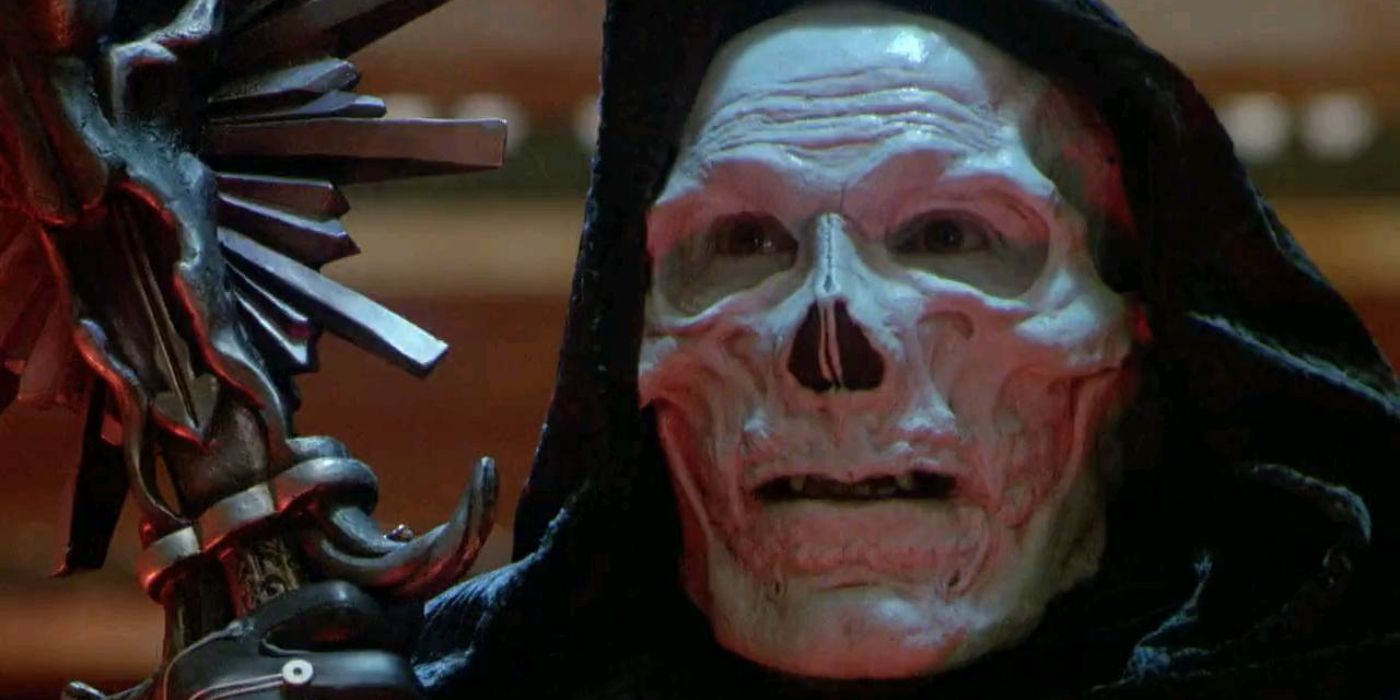 A close-up on Skeletor (Frank Langella) as he glares at someone while holding tightly to his staff in 'Masters of the Universe' (1987).