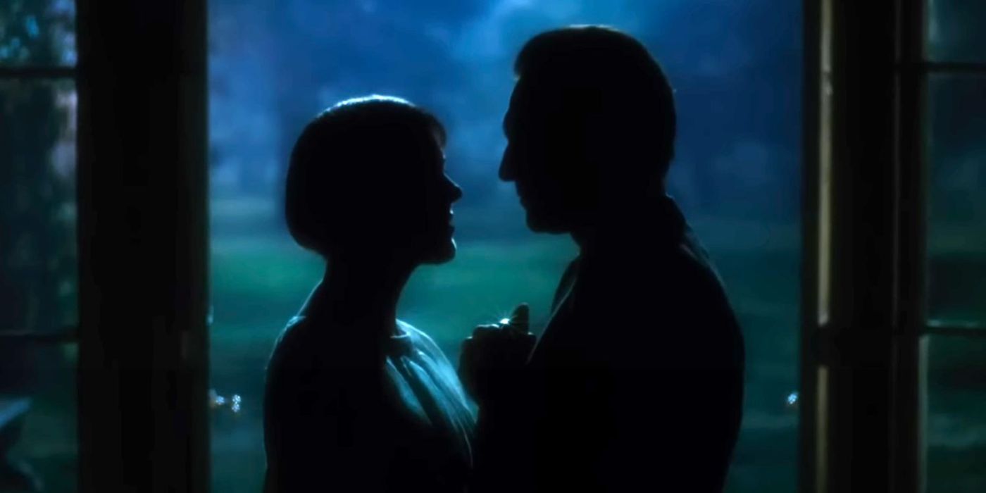 The shadows of Maria and Captain von Trapp as they look at each other lovingly. Both are standing under the door frame of a gazebo.