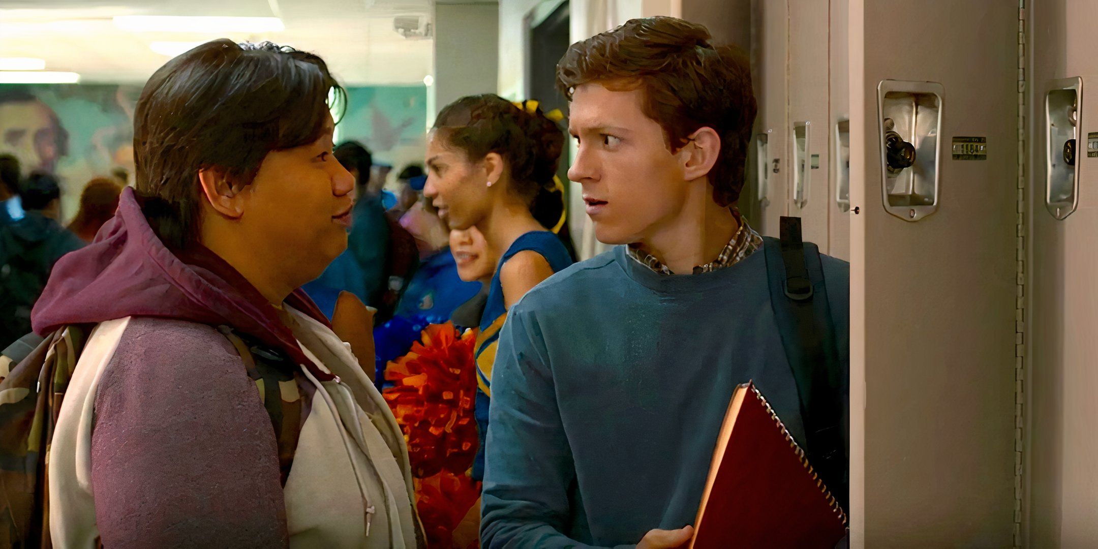 Ned (Jacob Batalon) and Peter (Tom Holland) chat at Peter's locker in Spider-Man: Homecoming (2017)