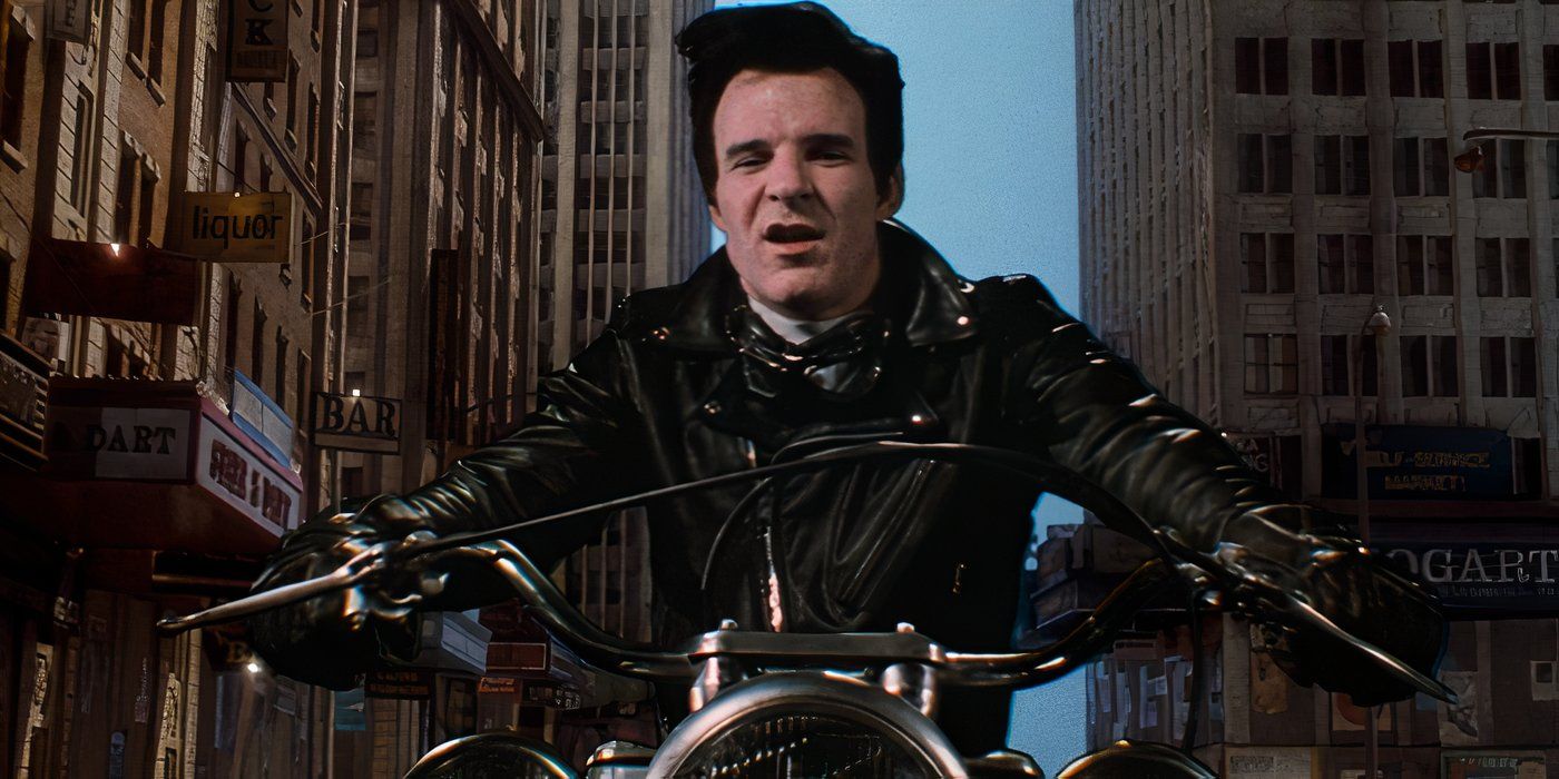 Actor Steve Martin as Orin in Little Shop of Horrors, driving a motorcycle in a city, wearing a black leather jacket.