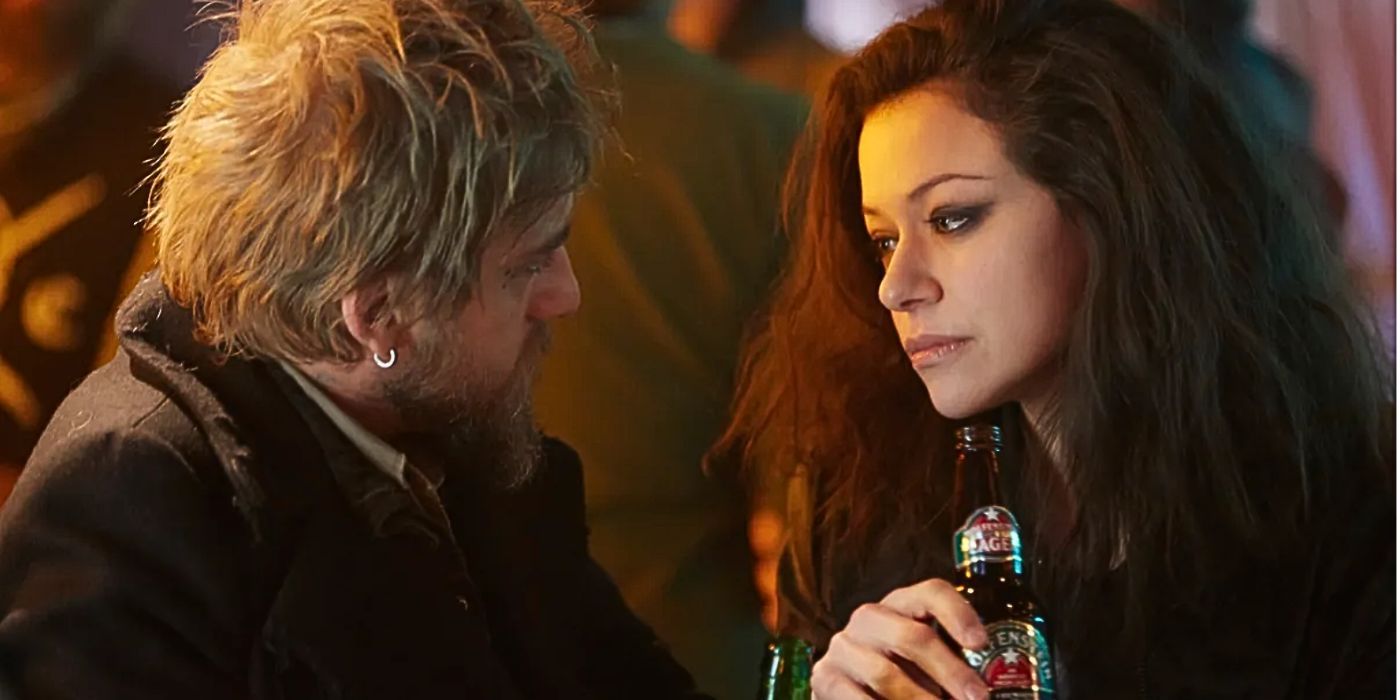 Tatiana Maslany as Sarah clone sitting at a bar with a beer talking to a stranger in the episode "The Antisocialism of Sex" from Orphan Black