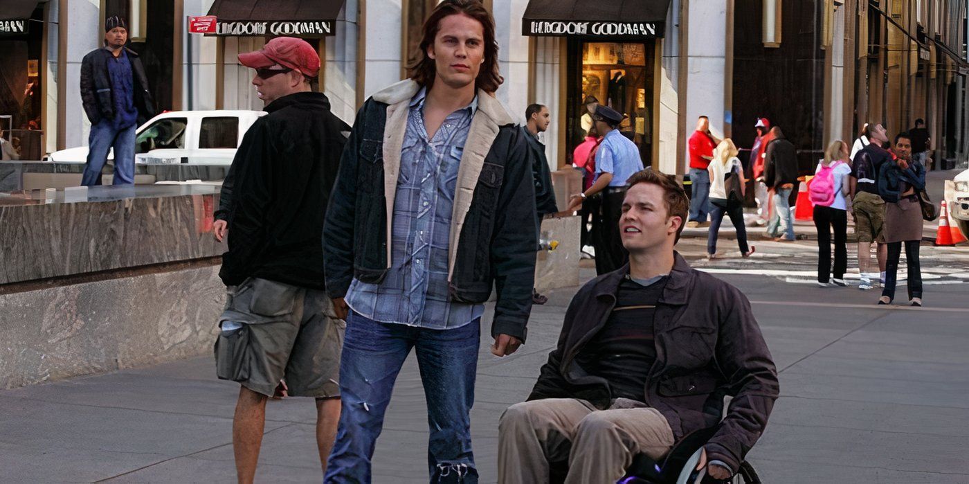 Tim stands beside and Jason in his wheelchair on the streets of New York in Friday Night Lights