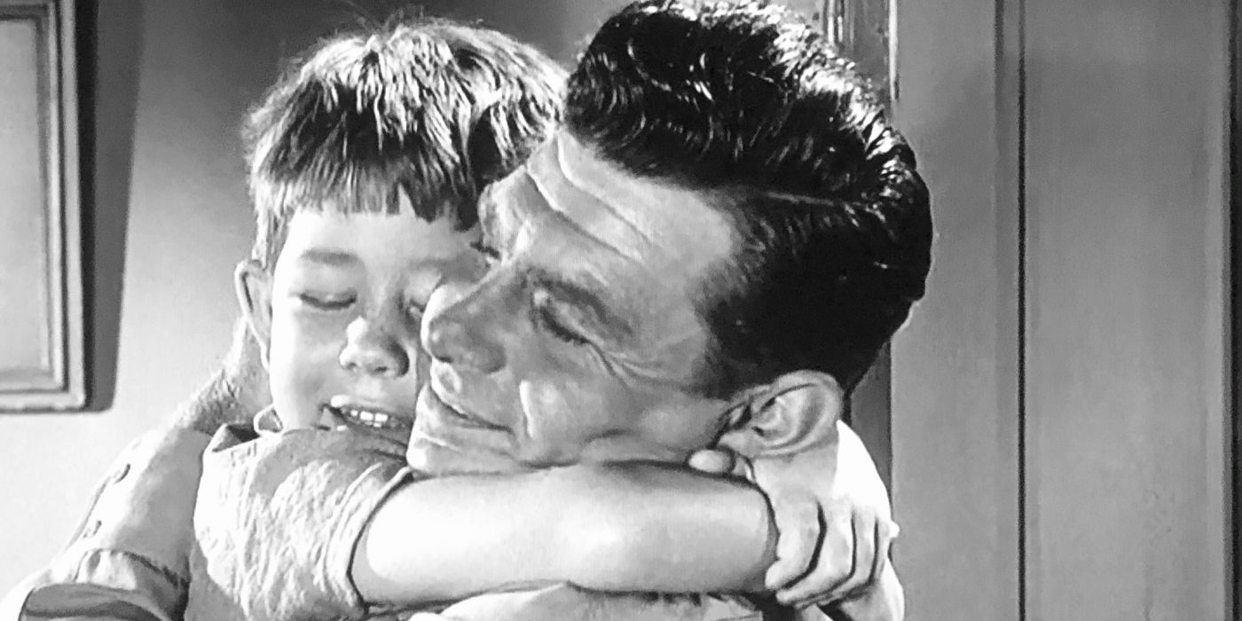 Andy Griffith hugs Ron Howard in a scene from 'The Andy Griffith Show.'