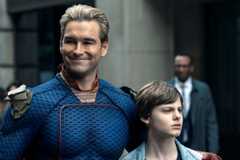 Antony Starr as Homelander with his arm around Cameron Crovetti as his son Ryan in Season 4 of The Boys