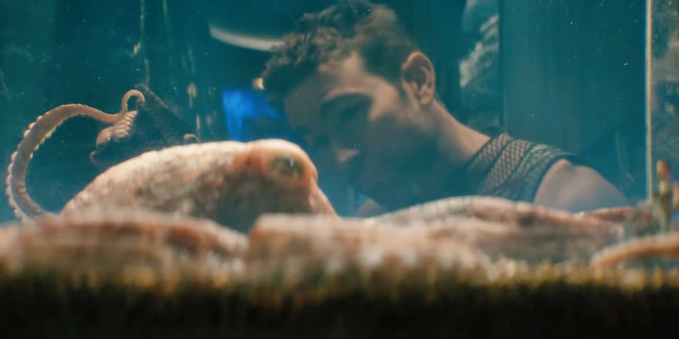 The Deep (Chace Crawford) looking into a tank containing the octopus Ambrosius (Tilda Swinton) in The Boys Season 4