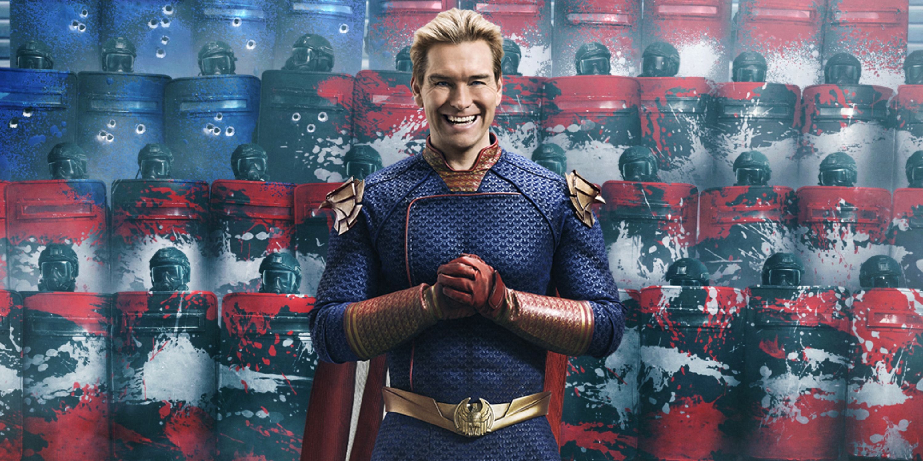 Antony Starr as Homelander with a menacing grin and his hands fisted at his chest in Season 4 of The Boys