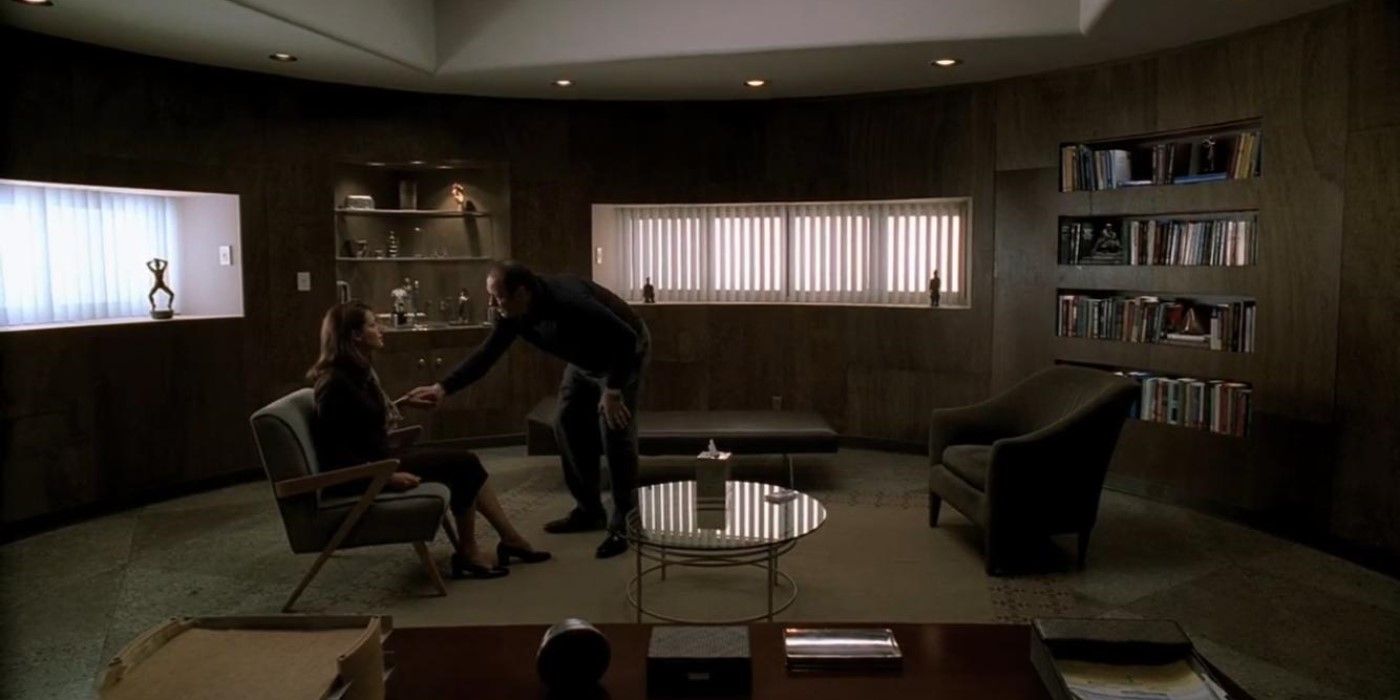 Tony Soprano (James Gandolfini) holds Dr. Melfi's (Lorraine Bracco) hand during therapy in The Sopranos.