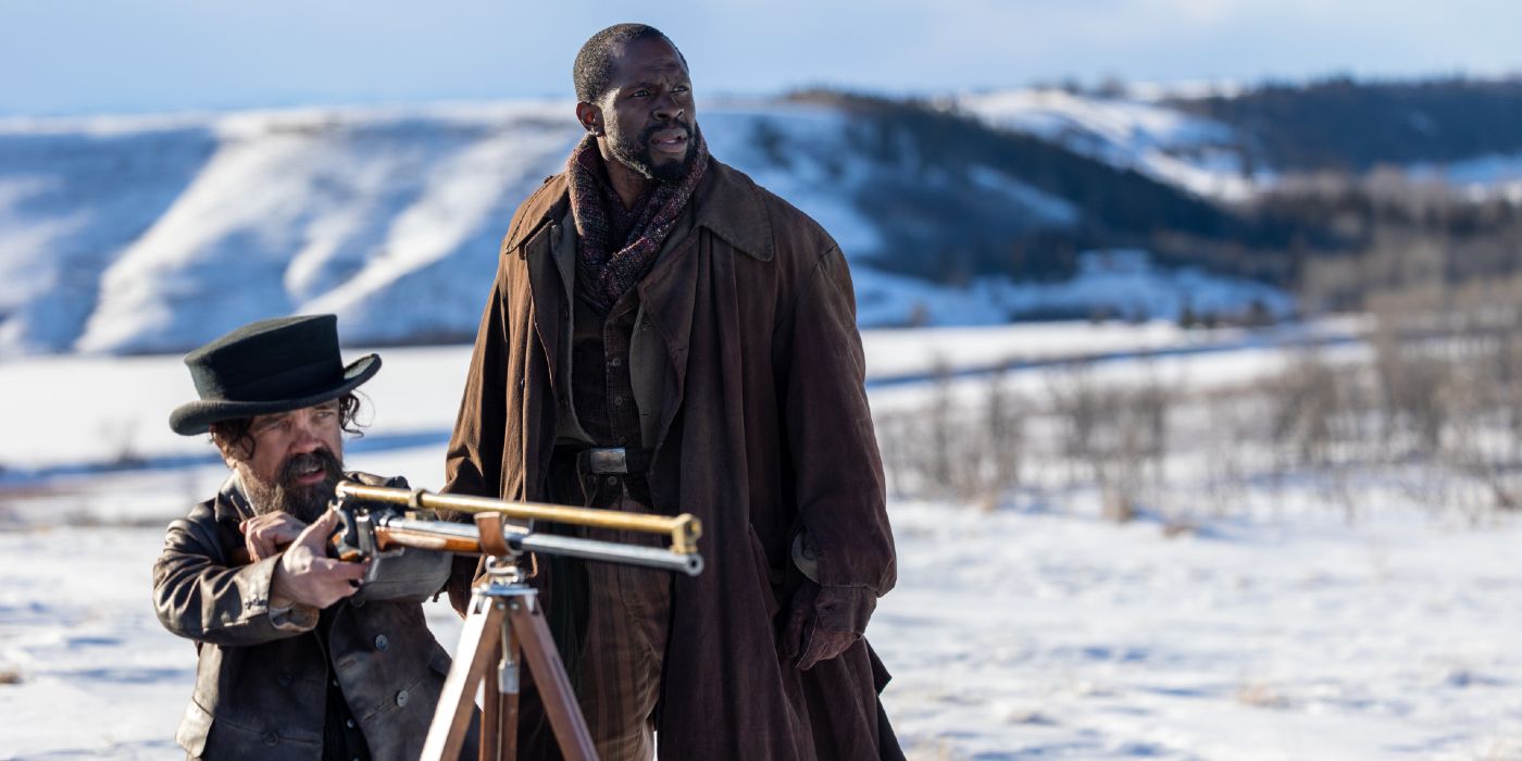 Peter Dinklage aiming his rifle on a snowy terrain, alongside Gbenga Akinnagbe in The Thicket
