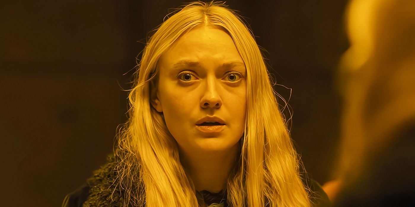 Dakota Fanning as Mina looking nervously out a window in a still from The Watchers. 