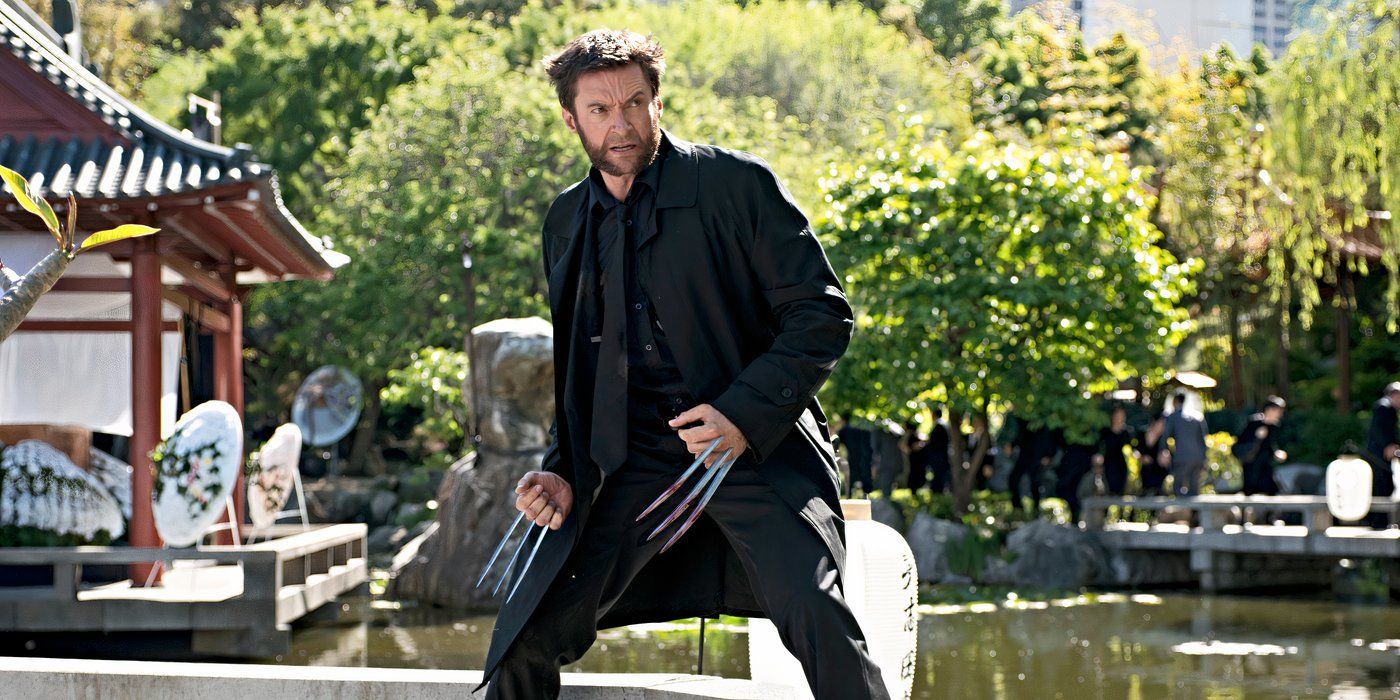 Hugh Jackman as Wolverine, standing with his claws out on a bridge in Japan in The Wolverine