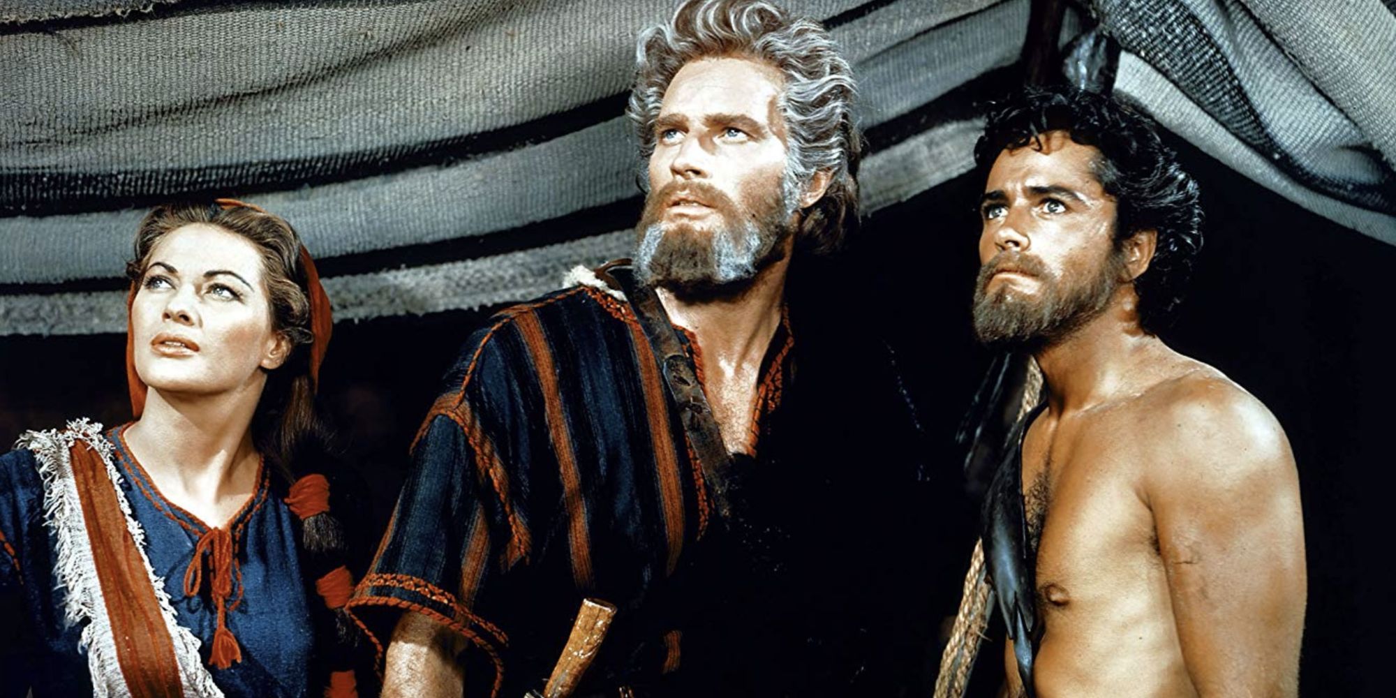 Cast members stand outside a tent and look up into the sky in &lsquo;The Ten Commandments.'