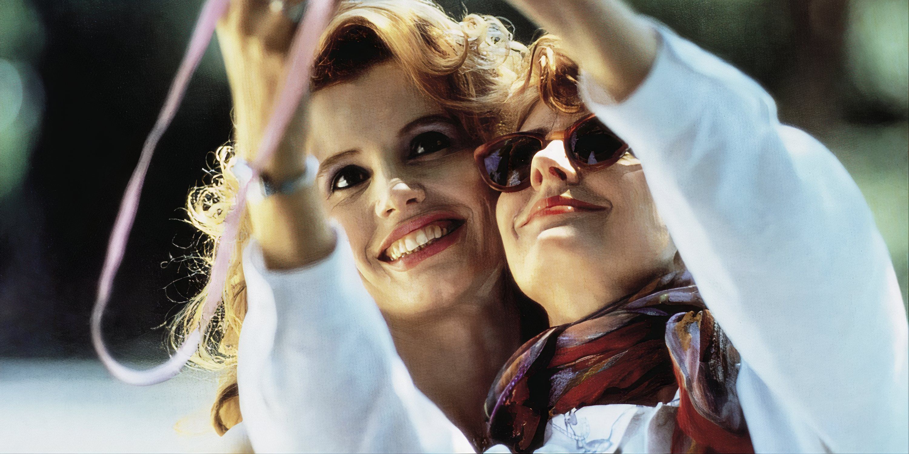 Geena Davis and Susan Sarandon taking a picture of themselves in Thelma and Louise.