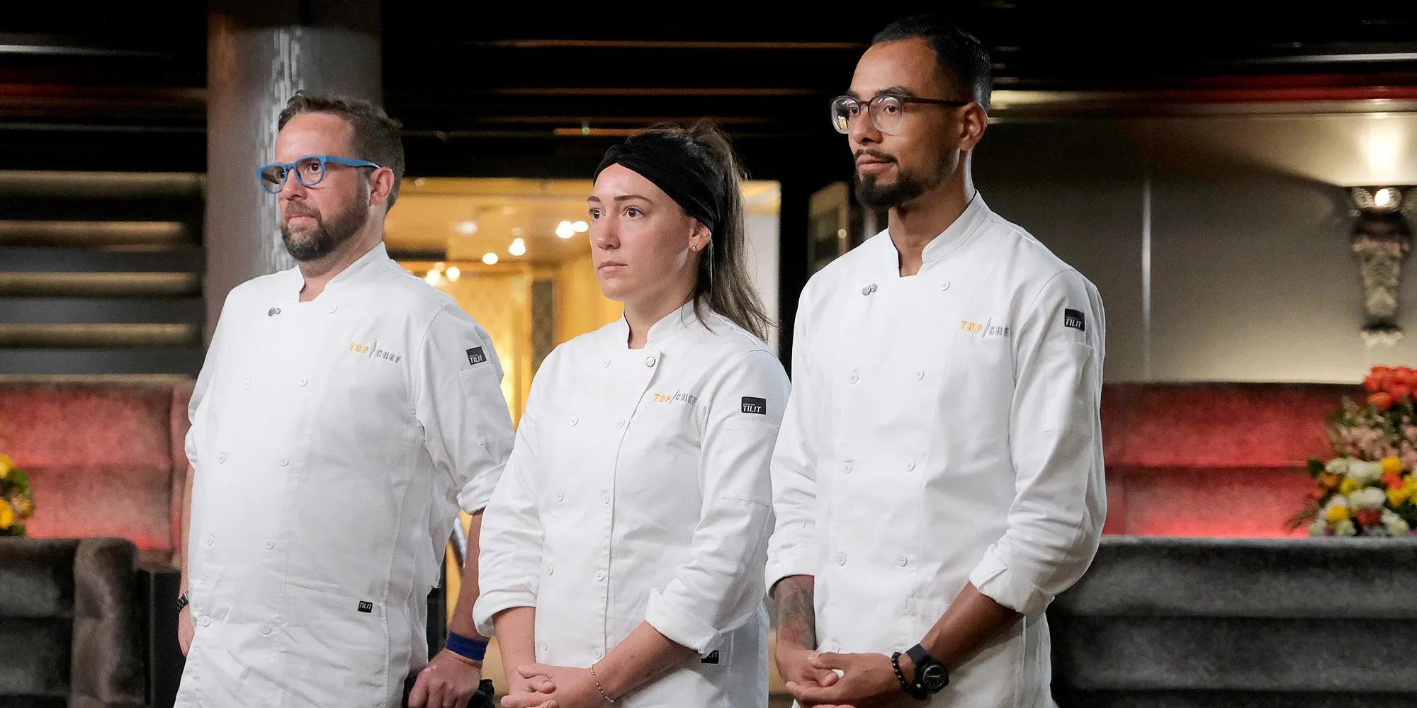 Three Top Chef contestants form Season 21 stand waiting for a decision