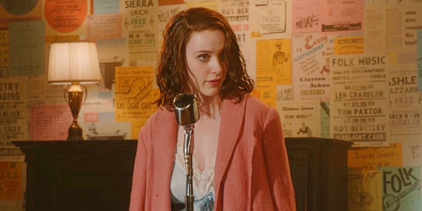 Midge Maisel onstage in front of a wall of flyers in the pilot episode of The Marvelous Mrs. Maisel