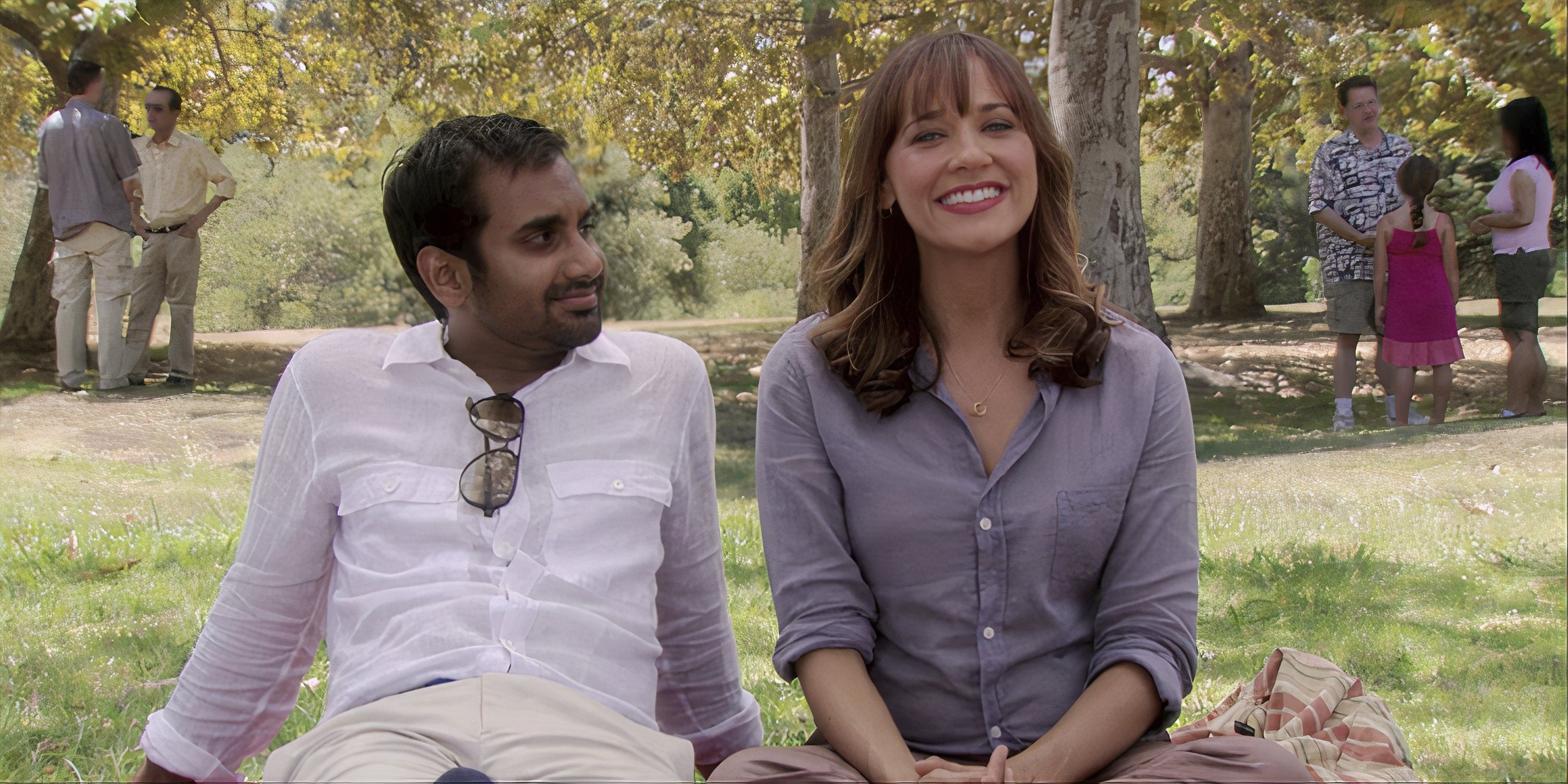 Tom and Ann sitting in a park in Parks and Rec
