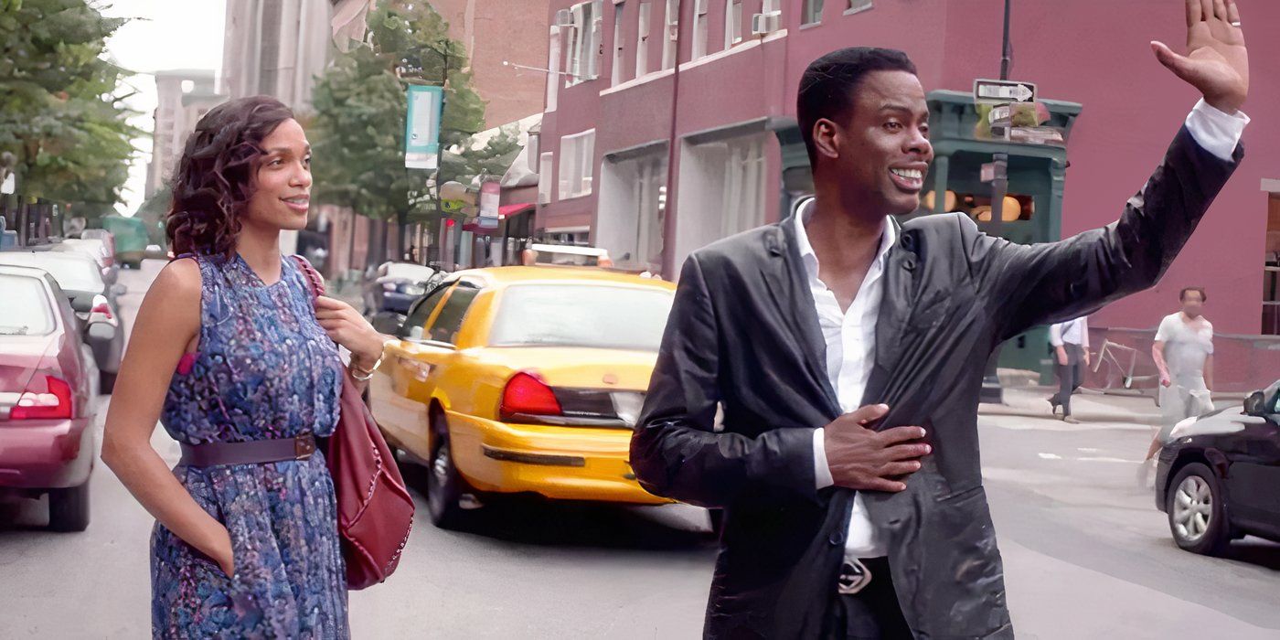 Chris Rock and Rosario Dawson smile on the street in Top Five