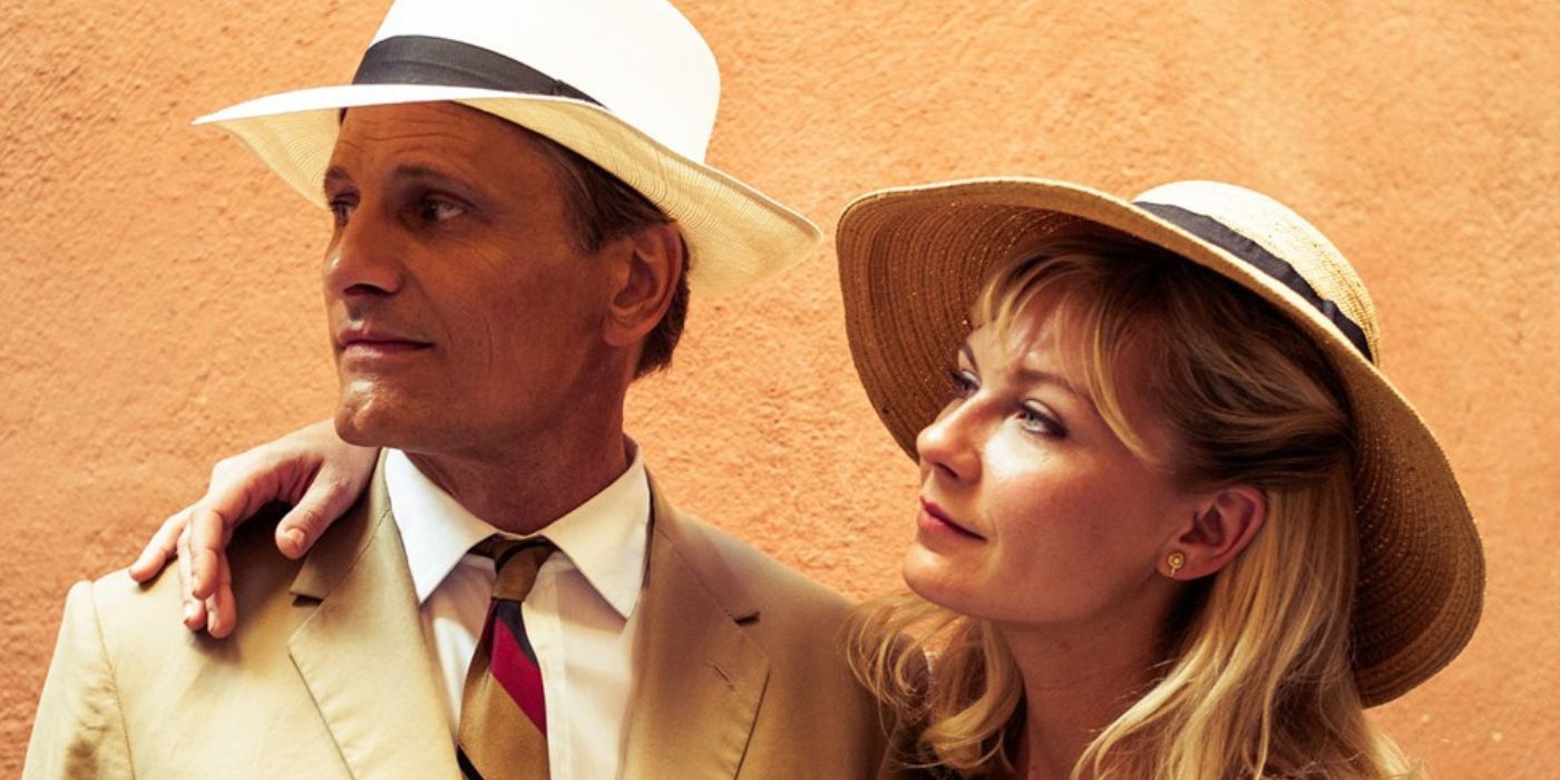 Kirsten Dunst with her arm around Viggo Mortensen in The Two Faces of January