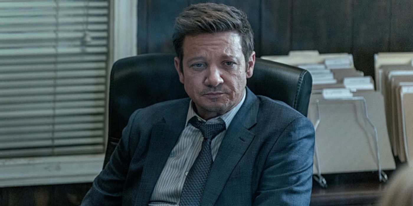 Jeremy Renner sitting at a desk in Mayor of Kingstown Season 3, Episode 2