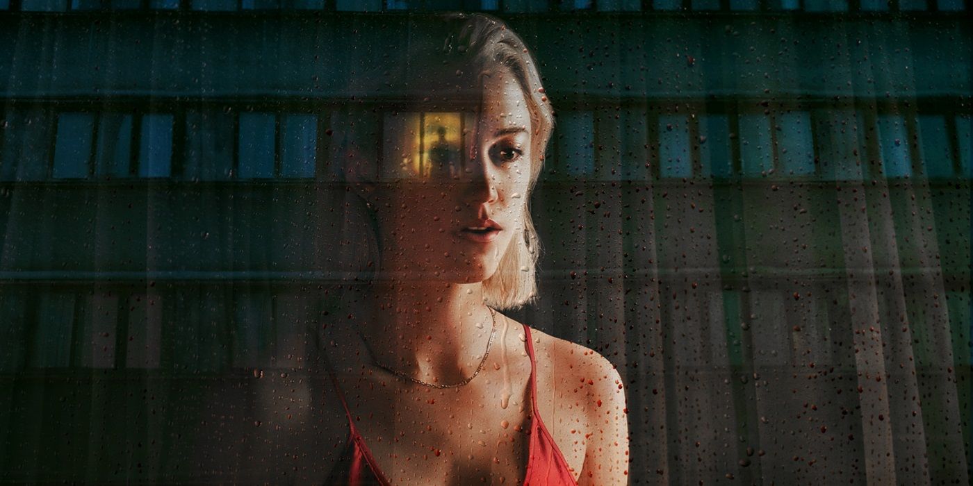 Maika Monroe in a poster for Watcher with a building on the background.