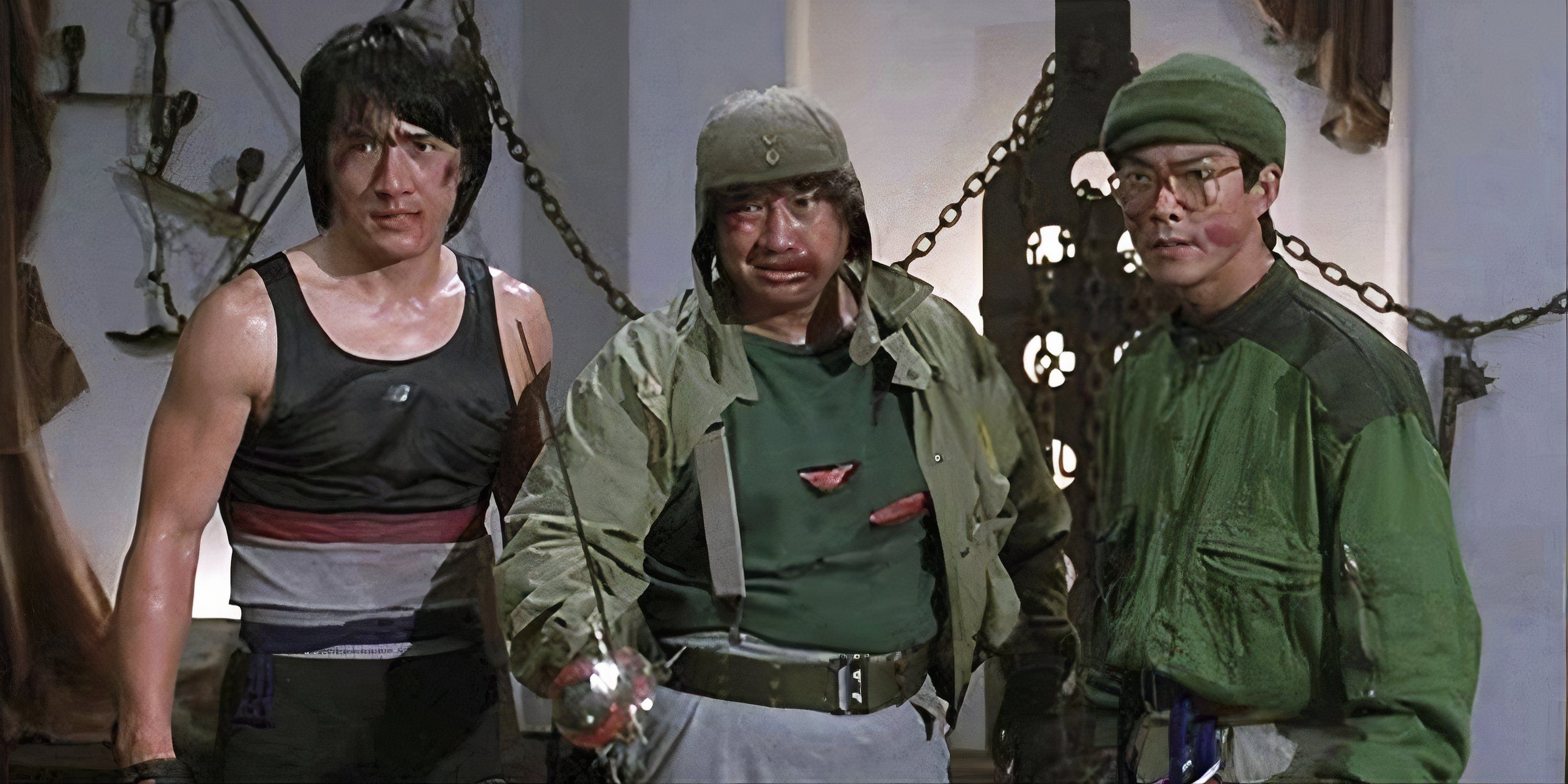 Jackie Chan standing with two soldiers in Wheels on Meals.
