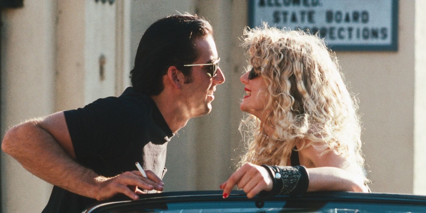 Nicolas Cage's Sailor leaning close to kiss Laura Dern's Lula in Wild at Heart?