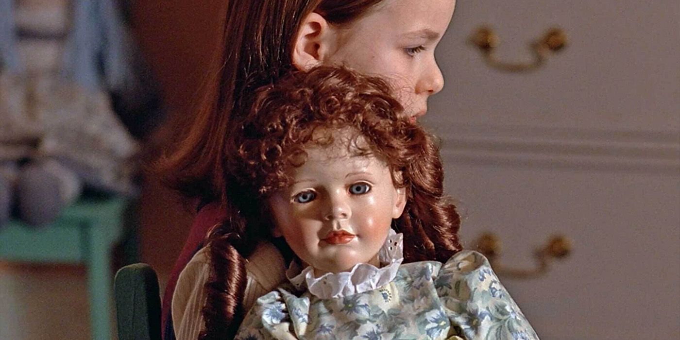 Jenny Lynn Hutchison as Polly Turner holds a doll in an episode of The X-Files "Chinga."