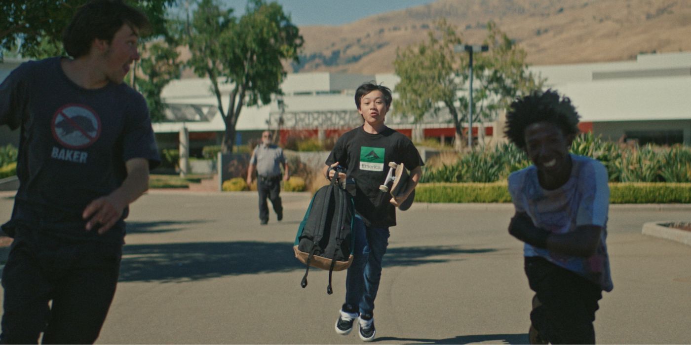 Izaac Wang as Chris, running away from a security guard in Didi