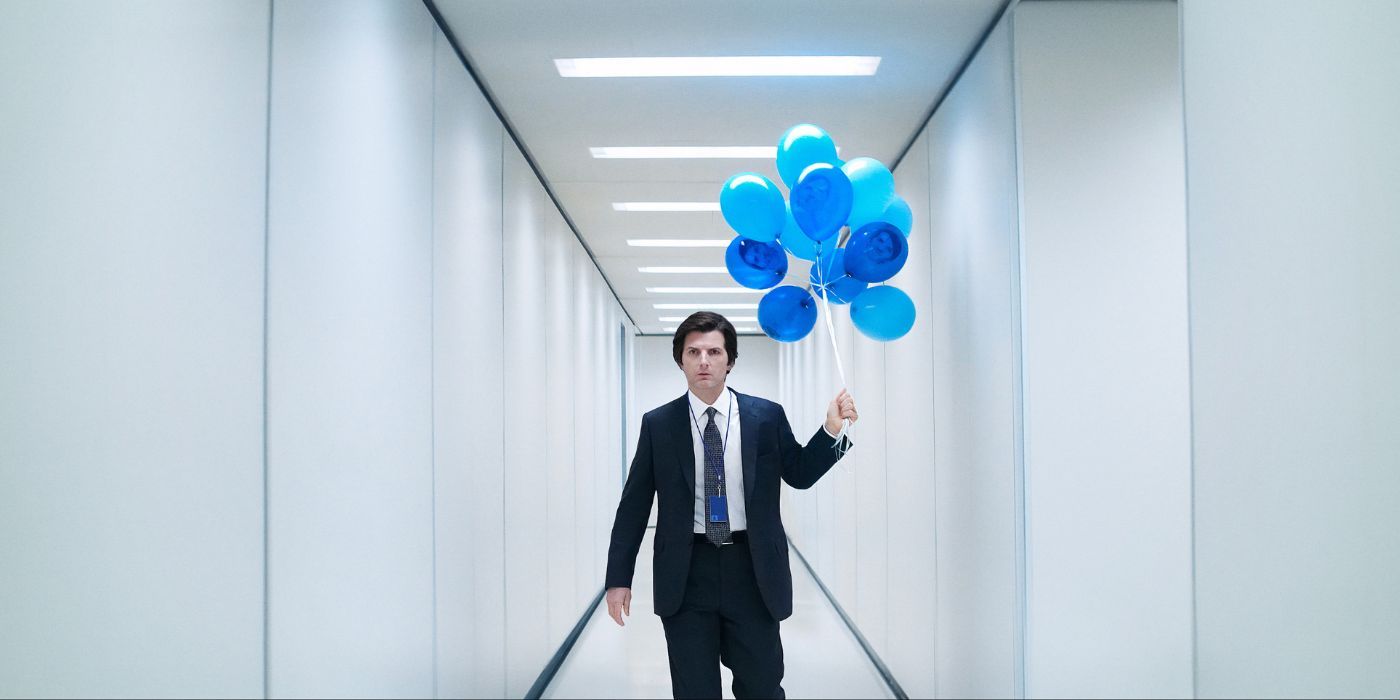 Adam Scott as Mark S, walking down a white hallway holding blue balloons in Severance Season 2.