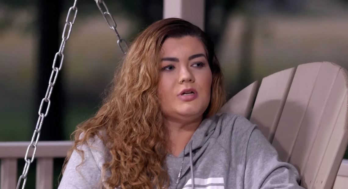 Amber Portwood from Teen Mom sits on a porch swing