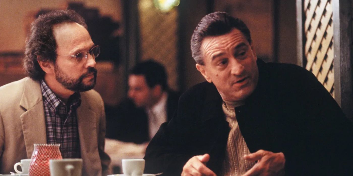 Paul and Ben, played by actors Robert De Niro and Billy Crystal, sit at the table of a restaurant together in Analyze This.