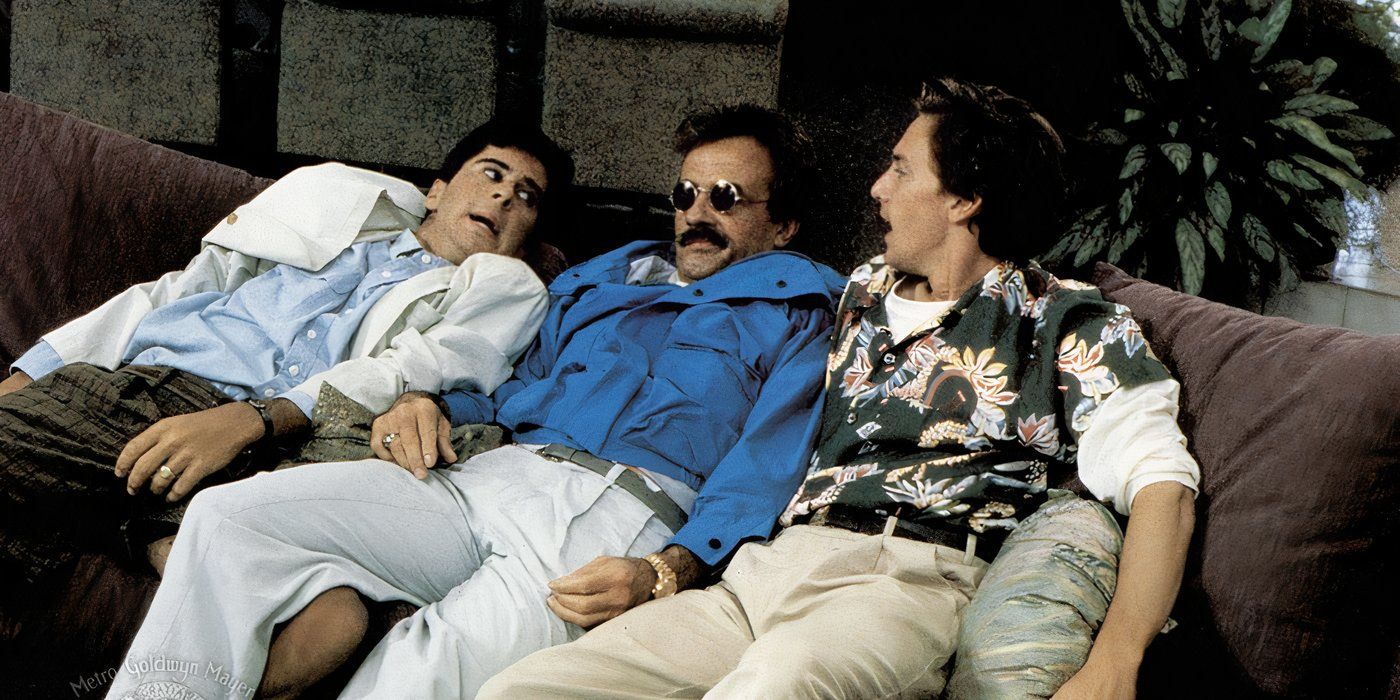 Three men sit on a couch while the one in the middle wears sunglasses in Weekend at Bernie's (1989)