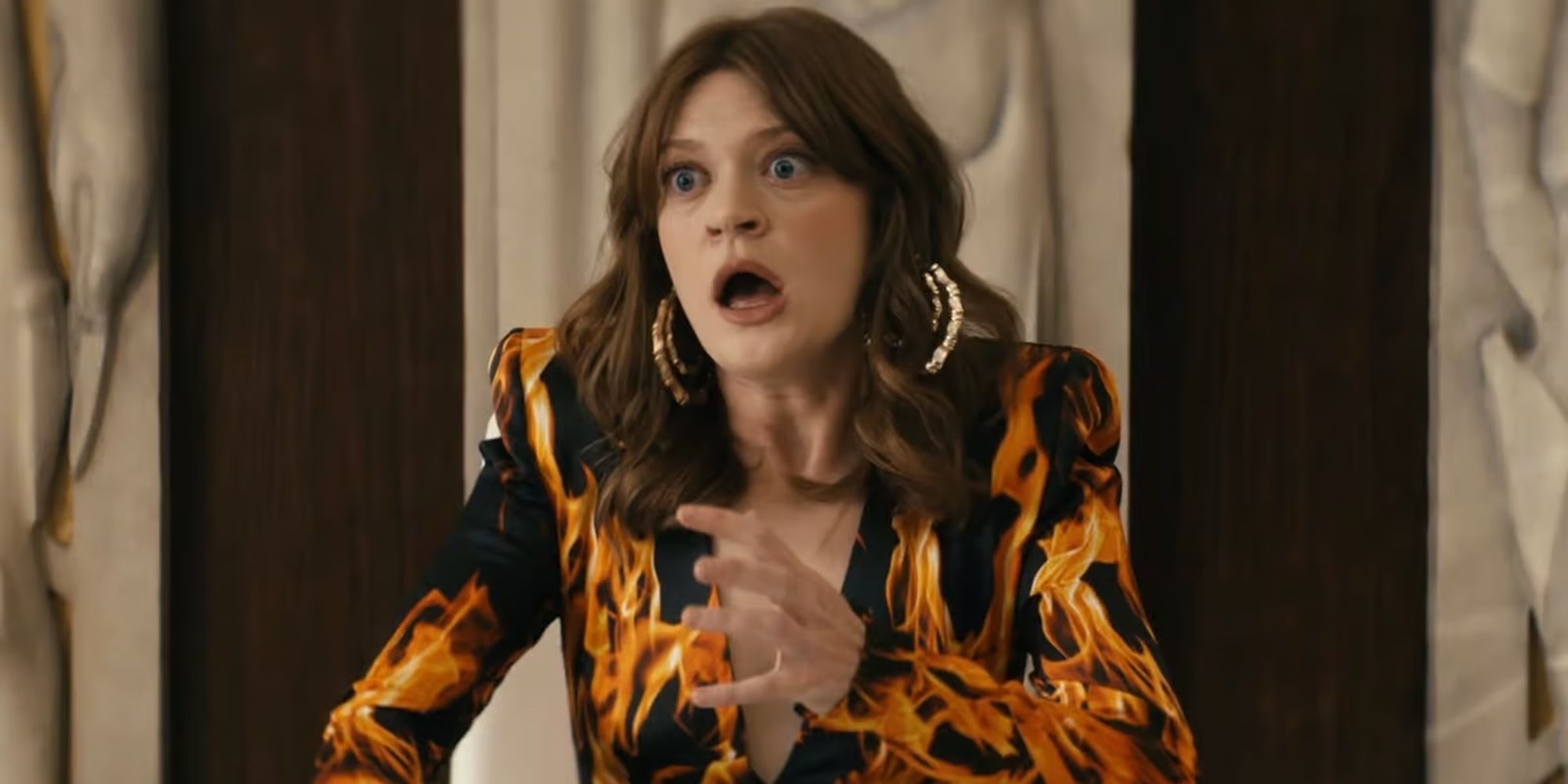 Ashley Barrett (Colbie Minifie) looking shocked while wearing a flaming suit in The Boys Season 4