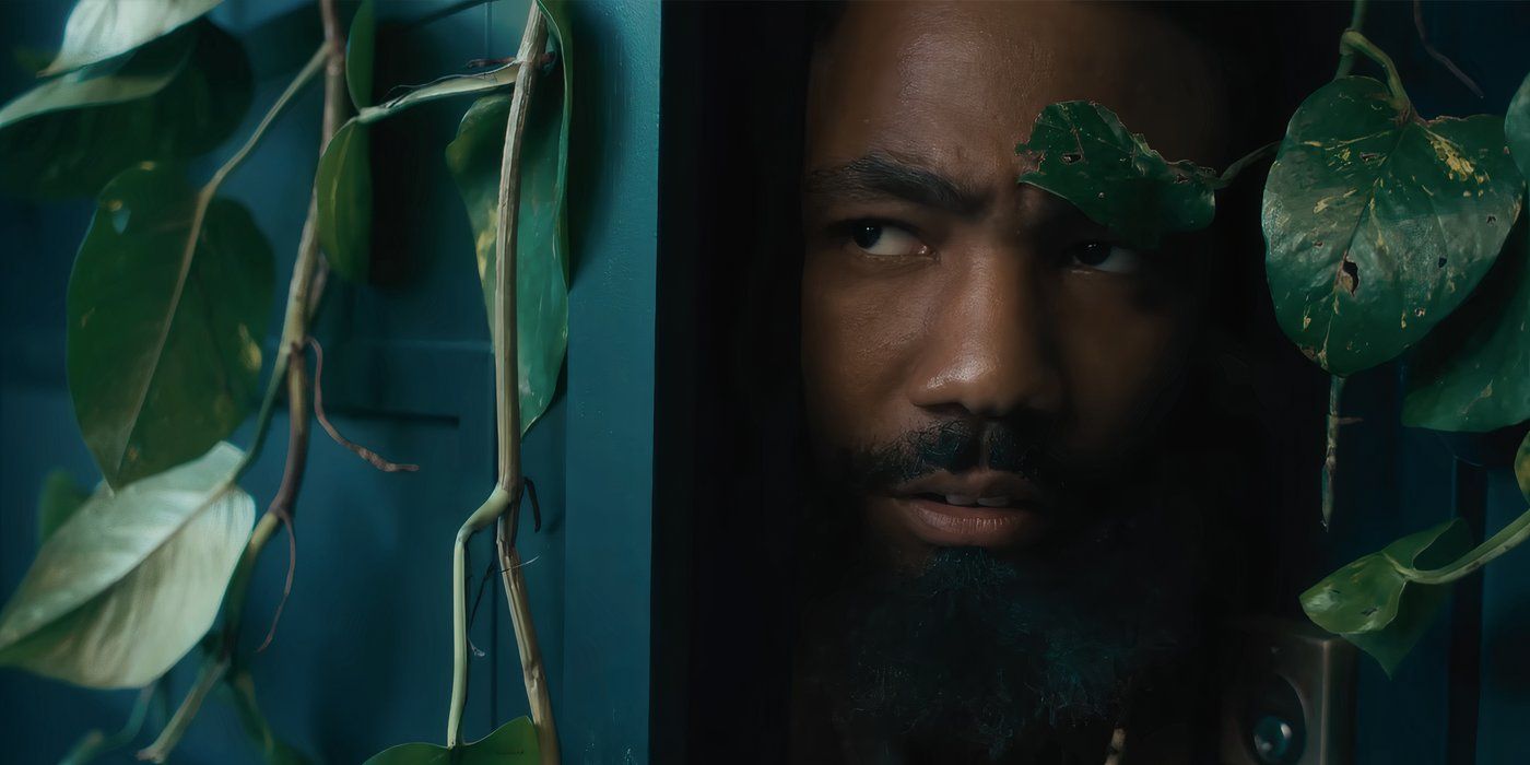 Donald Glover peeping out of a door covered in ivy in Bando Stone and the New World.