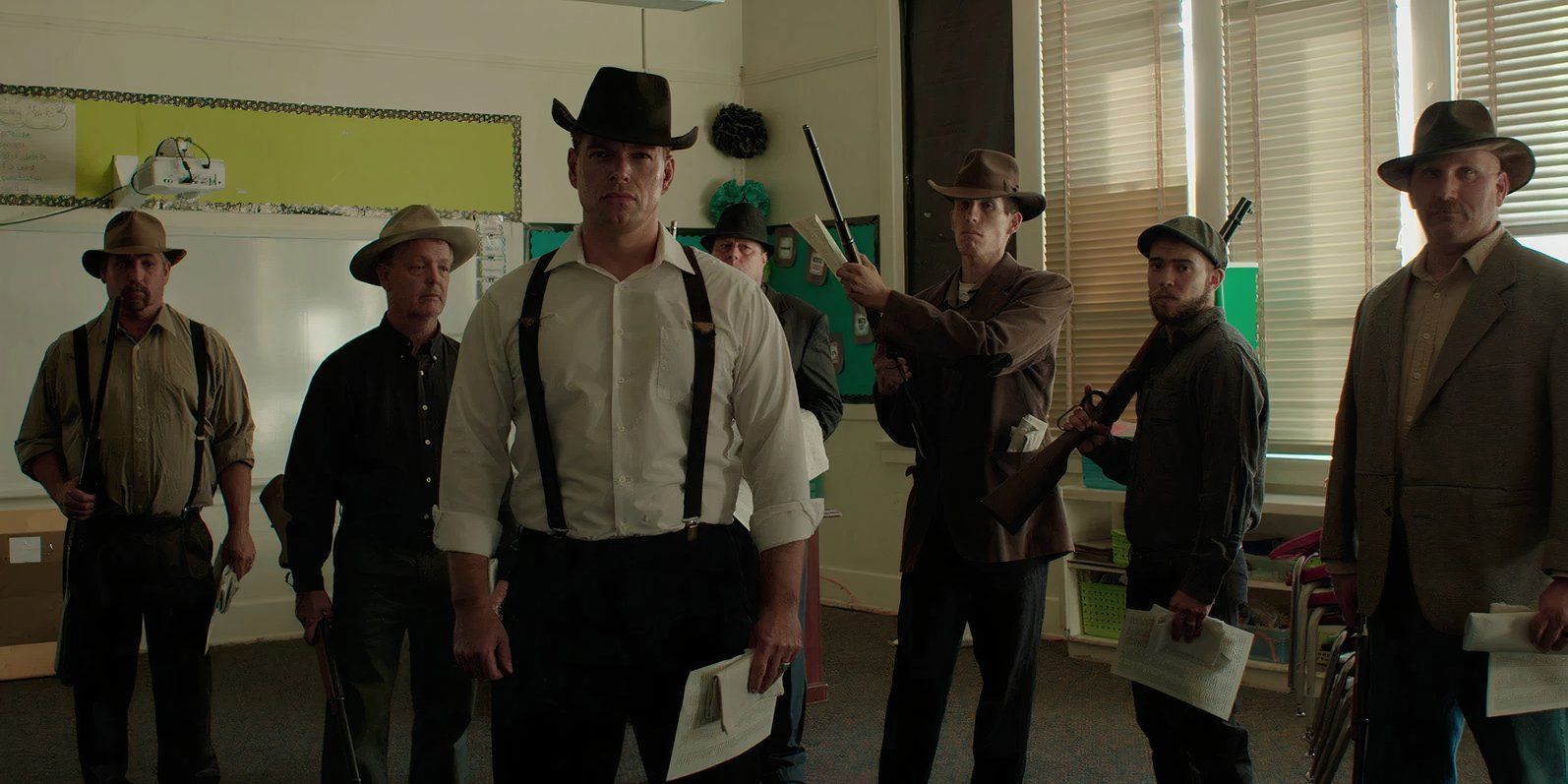 Bisbee '17 cast members standing together during the deputizing scene