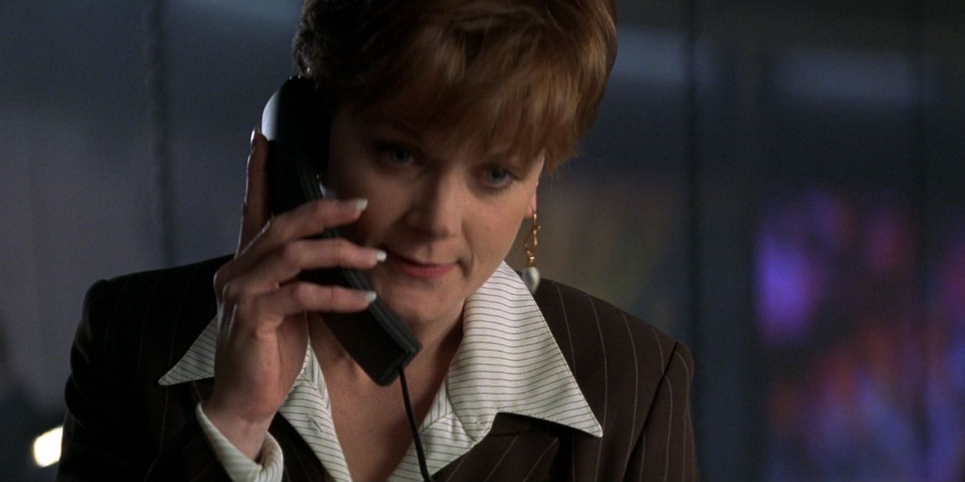 Miss Moneypenny (Samantha Bond) speaks on the phone to James Bond in 'Tomorrow Never Dies' (1997).