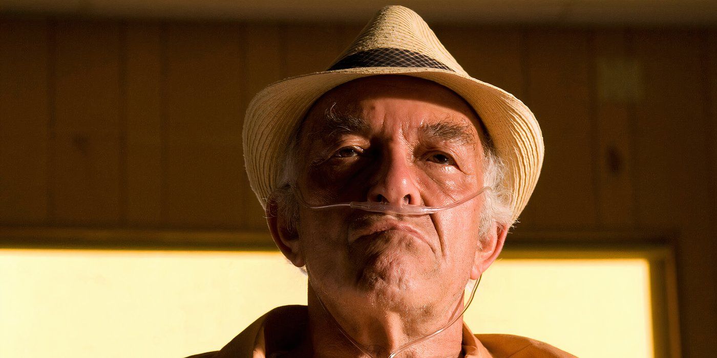 Hector wearing a hat, oxygen tubes up his nose on Breaking Bad.