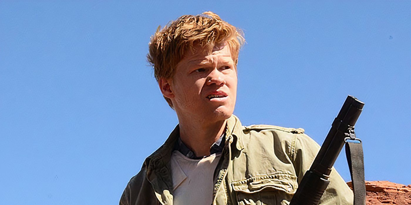 Todd in the desert looking up while hiding a rifle on Breaking Bad.