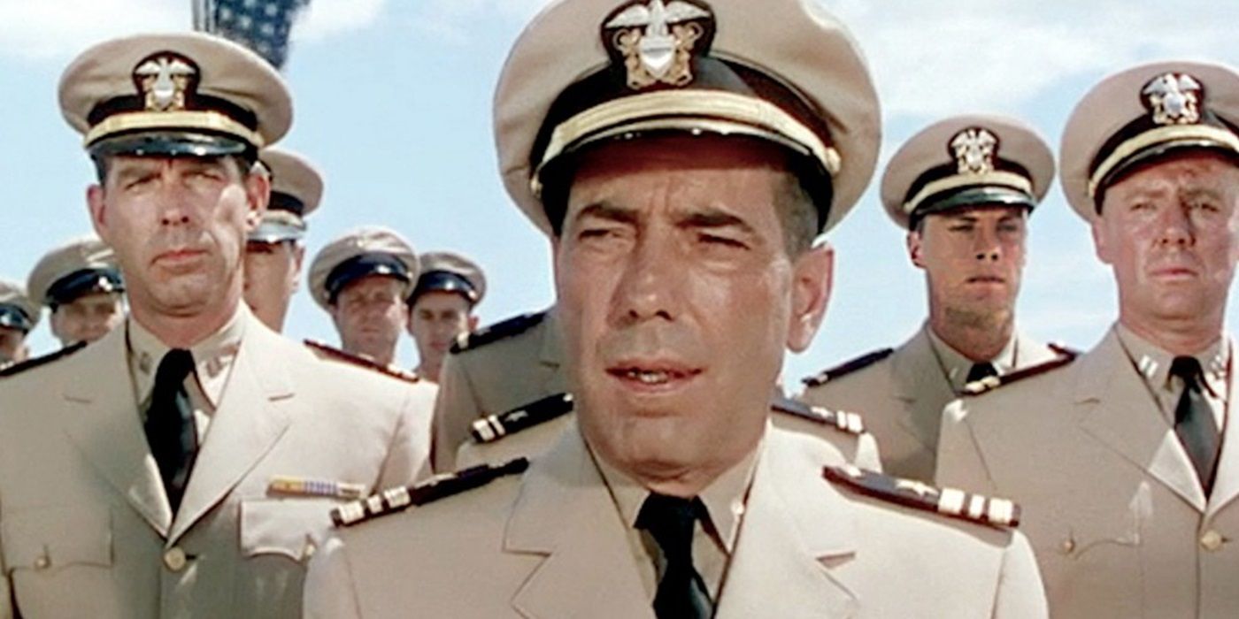 Humphrey Bogart as Philip Francis Queeg standing among soldiers in The Caine Mutiny