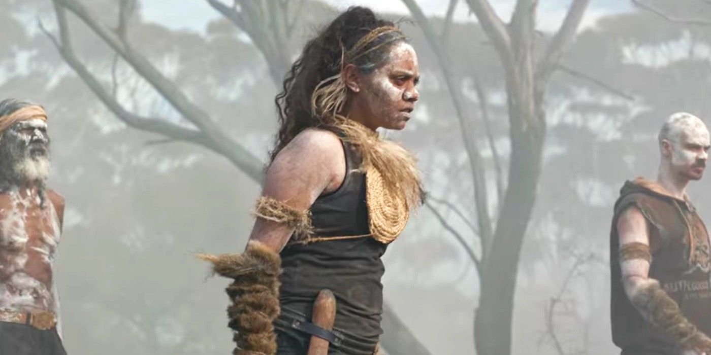 Natasha Wanganeen as Josie Bell wearing traditional Aboriginal clothes and makeup in a smoky area in Cargo