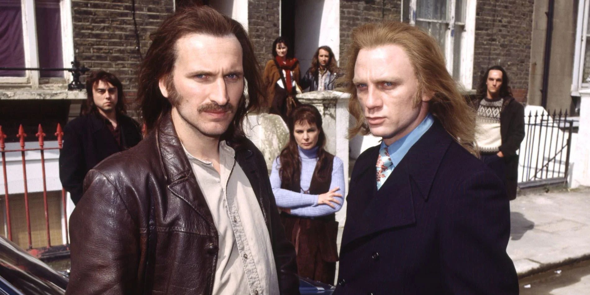 Christopher Eccleston as Nicky and Daniel Craig as Geordie posing outside a house in Our Friends in the North