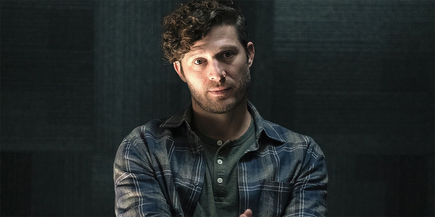 Zach Gilford as Sicarius sitting and looking off in the distance in Criminal Minds: Evolution