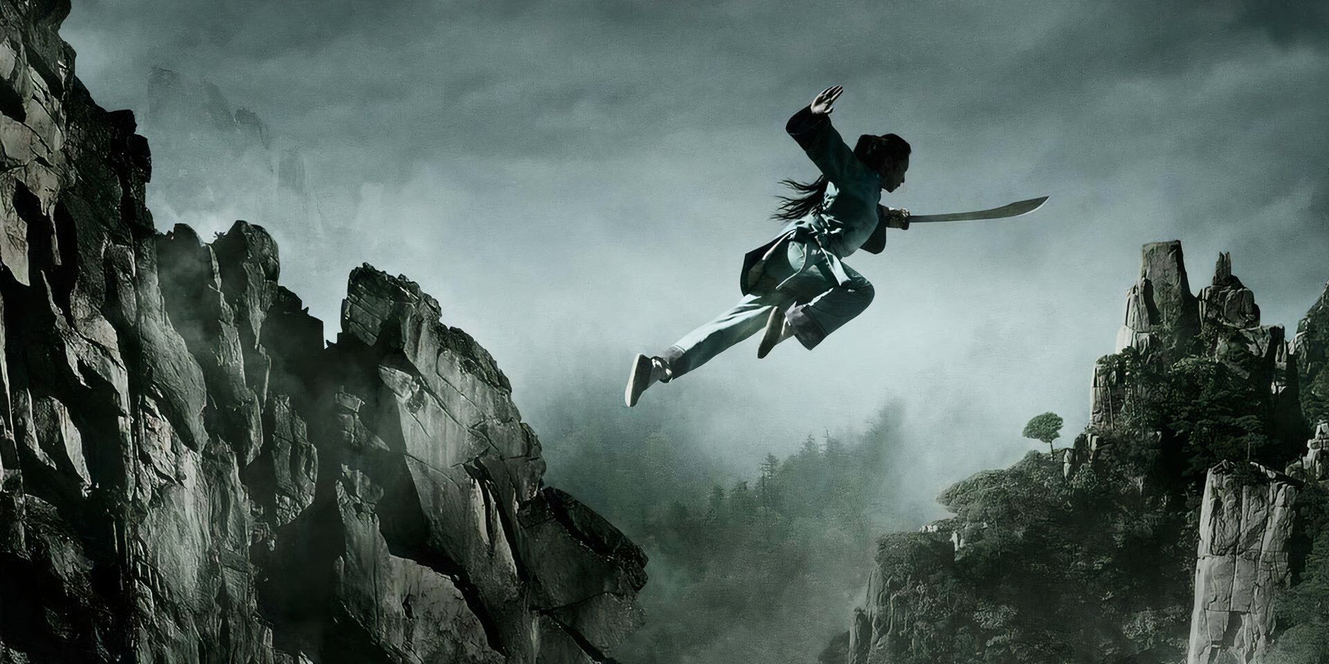 Michelle Yeoh as Yu Shu Lien jumping with a sword in her hand in 'Crouching Tiger, Hidden Dragon: Sword of Destiny' (2016)