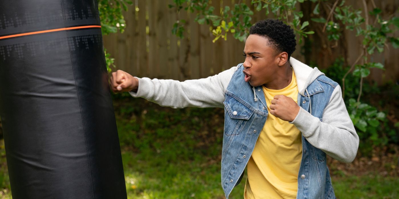 Dallas Dupree Young as Kenny Payne, practicing his moves on a punching bag in Cobra Kai Season 6 Part 1.