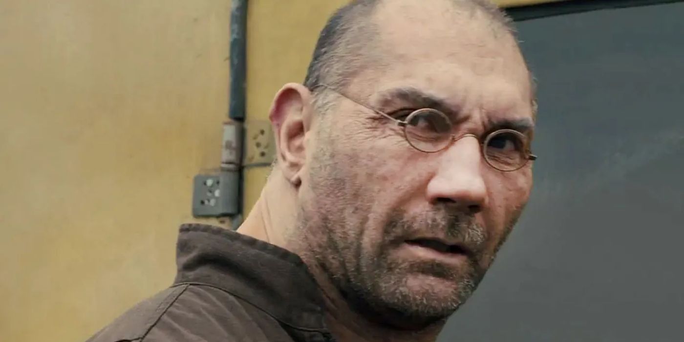 Sapper Morton with glasses turnign aorund in Blade Runner 2049