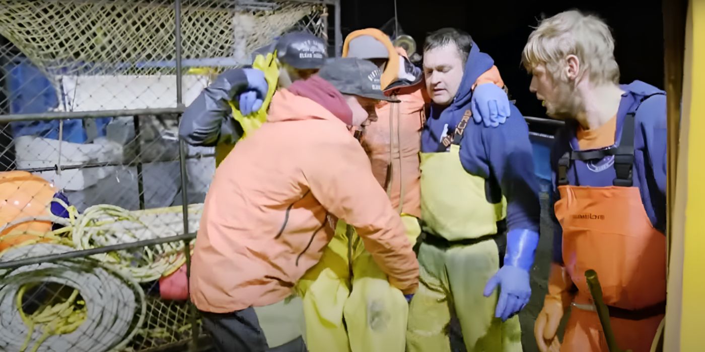 Crewmates help carry an injured man onboard a ship on Deadliest Catch.