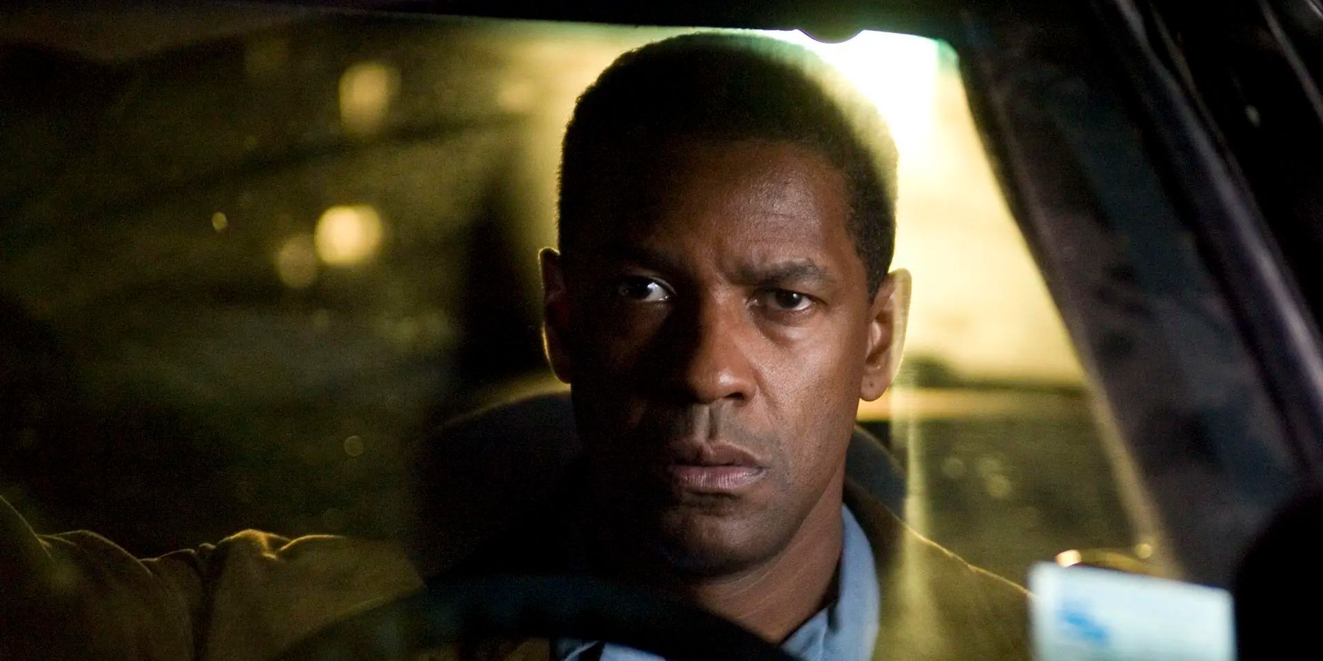 Denzel Washington as Doug Carlin sits in a car in Tony Scott&rsquo;s &lsquo;Deja Vu&rsquo;